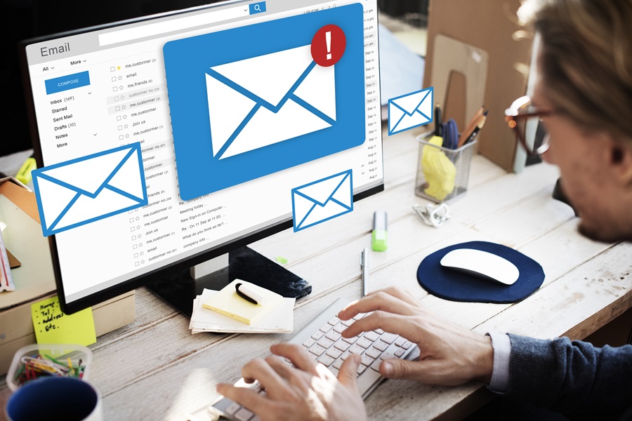 Stop spam email and contact us form spam - 360 Web Firm - Person on PC receiving a lot of spam emails.